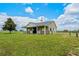 Horse barn exterior, surrounded by green grass and perimeter fencing at 2350 Bradbury Rd, Haines City, FL 33844