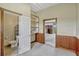 Barn room with wainscoting, shelves, bathroom, and open area with pasture view at 2350 Bradbury Rd, Haines City, FL 33844