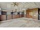 Bright barn interior showcasing horse stalls with wood and metal finishes, concrete floors, and well-lit space for equestrian activities at 2350 Bradbury Rd, Haines City, FL 33844