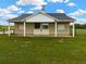 Close exterior view of a barn highlighting its design, surrounded by green grass and a clear sky at 2350 Bradbury Rd, Haines City, FL 33844