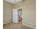 Bedroom featuring neutral carpet, light walls and a view to the second floor at 2350 Bradbury Rd, Haines City, FL 33844