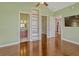 Bright room with an open view of the ensuite bathroom and staircase through doorways at 2350 Bradbury Rd, Haines City, FL 33844