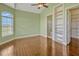 Bedroom with a large window, built-in shelves, and access to the bathroom and walk-in closet at 2350 Bradbury Rd, Haines City, FL 33844