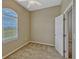 Bright bedroom with carpet flooring, ceiling fan, and arched window at 2350 Bradbury Rd, Haines City, FL 33844