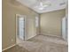 Bedroom featuring neutral carpet and ceiling fan with a view to the hallway at 2350 Bradbury Rd, Haines City, FL 33844