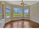 Sunny bonus room boasts gleaming hardwood floors and picturesque views of the backyard at 2350 Bradbury Rd, Haines City, FL 33844