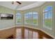 Light-filled bonus room offers hardwood floors, large windows, and views of the yard at 2350 Bradbury Rd, Haines City, FL 33844