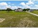 Expansive property with a long driveway leading to a large two-story home and detached garage at 2350 Bradbury Rd, Haines City, FL 33844