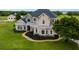 Captivating two-story home boasts stone accents, lush front yard landscaping, and a brick walkway at 2350 Bradbury Rd, Haines City, FL 33844