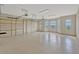 Spacious garage with epoxy flooring, multiple bays, and natural light from arched windows at 2350 Bradbury Rd, Haines City, FL 33844