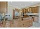 Spacious kitchen featuring custom cabinetry, granite countertops, and a center island at 2350 Bradbury Rd, Haines City, FL 33844