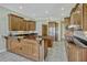 Gourmet kitchen features custom wood cabinetry, granite countertops, and stainless appliances at 2350 Bradbury Rd, Haines City, FL 33844