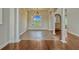 Bright open-concept room featuring hardwood floors and large windows, perfect for relaxation at 2350 Bradbury Rd, Haines City, FL 33844