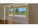 View of screened-in lanai featuring a pool, spa, and a lush green lawn at 2350 Bradbury Rd, Haines City, FL 33844