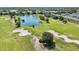 Scenic aerial view of the community's beautiful golf course and pond at 2462 Sweet Viburnum Way, Ocoee, FL 34761