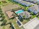 Overhead shot of community pool, playground, clubhouse, and pond at 2462 Sweet Viburnum Way, Ocoee, FL 34761