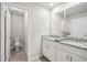 Bright bathroom featuring double vanity, granite countertops, and tile floors at 2462 Sweet Viburnum Way, Ocoee, FL 34761
