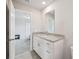Stylish bathroom with a granite countertop vanity and tiled flooring at 2462 Sweet Viburnum Way, Ocoee, FL 34761