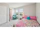 Bright bedroom with carpet, pastel decor, and natural light from the double windows at 2462 Sweet Viburnum Way, Ocoee, FL 34761