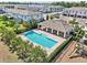 Community pool area, featuring a playground and lush landscaping, under a sunny sky at 2462 Sweet Viburnum Way, Ocoee, FL 34761