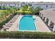 Inviting community pool with lounge chairs and a covered seating area at 2462 Sweet Viburnum Way, Ocoee, FL 34761