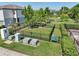 Aerial view of fenced dog park with grassy area and mature trees at 2462 Sweet Viburnum Way, Ocoee, FL 34761