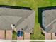 Aerial view of townhome driveways with brick pavers, landscaping, and convenient parking at 2462 Sweet Viburnum Way, Ocoee, FL 34761