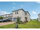 A view of the home's exterior, showcasing its neat landscaping at 2462 Sweet Viburnum Way, Ocoee, FL 34761