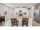 Well-lit kitchen featuring a central island and modern appliances at 2462 Sweet Viburnum Way, Ocoee, FL 34761