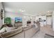 Open-concept living area seamlessly connects to the modern kitchen and dining space at 2462 Sweet Viburnum Way, Ocoee, FL 34761
