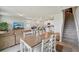 Bright, open-concept living space flows into the dining area and modern kitchen, perfect for entertaining at 2462 Sweet Viburnum Way, Ocoee, FL 34761