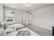 Cozy upstairs loft area with plush seating, neutral tones, and ample natural light at 2462 Sweet Viburnum Way, Ocoee, FL 34761