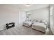 Bright loft featuring a comfy couch, neutral tones, and natural light at 2462 Sweet Viburnum Way, Ocoee, FL 34761