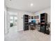 Comfortable home office space with gray walls, a golf bag and custom desk chair at 2462 Sweet Viburnum Way, Ocoee, FL 34761