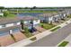 Stylish townhomes with brick driveways facing a scenic pond at 2462 Sweet Viburnum Way, Ocoee, FL 34761