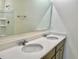 Bathroom with double vanity, quartz countertop, and walk-in shower at 2569 Trinidad Rd, Haines City, FL 33844