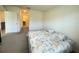 Bedroom with neutral walls, carpeted floor, and bed with Paris-themed comforter at 2569 Trinidad Rd, Haines City, FL 33844