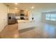 Open concept kitchen featuring a central island, stainless steel appliances, and neutral finishes at 2569 Trinidad Rd, Haines City, FL 33844