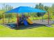 Community playground with slides, swings and protective shade structure perfect for outdoor play at 2569 Trinidad Rd, Haines City, FL 33844