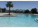 Beautiful community pool featuring ample seating and shaded areas, perfect for relaxation and socializing at 2569 Trinidad Rd, Haines City, FL 33844