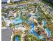 Aerial view of community lazy river, splash pad, playground, and other outdoor amenities at 2605 Scrapbook St, Kissimmee, FL 34746