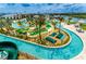 Aerial view of the community lazy river and recreation area with lush tropical landscaping at 2605 Scrapbook St, Kissimmee, FL 34746