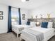 Charming ' bedroom with twin beds and playful Mickey Mouse themed decor at 2605 Scrapbook St, Kissimmee, FL 34746