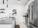 Modern kitchen with stainless steel appliances, subway tile backsplash, and sleek countertops at 2605 Scrapbook St, Kissimmee, FL 34746