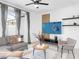 Comfortable living room with stylish decor, neutral color palette, and access to outdoor space at 2605 Scrapbook St, Kissimmee, FL 34746