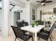 Outdoor patio with dining set, perfect for enjoying meals outside at 2605 Scrapbook St, Kissimmee, FL 34746