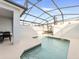 A refreshing pool in a screened enclosure, perfect for relaxing by the water at 2605 Scrapbook St, Kissimmee, FL 34746
