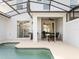 Pool area featuring a grill and an outdoor dining area at 2605 Scrapbook St, Kissimmee, FL 34746
