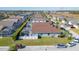Aerial view of a neighborhood showcasing the backyard, fencing, pool enclosures and proximity to other homes at 307 Fox Loop, Davenport, FL 33837