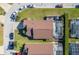 Aerial shot of a home with an enclosed pool, showing the property's layout and neighborhood at 307 Fox Loop, Davenport, FL 33837